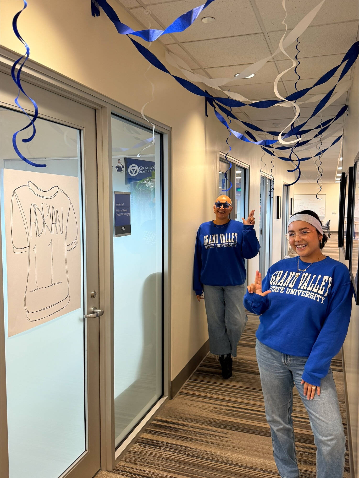 Photo of homecoming decorations with individuals posing